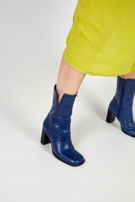 "INTENTIONALLY __________." Parade Boots - Blue